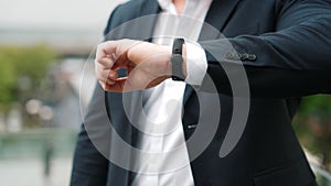 Close up of business man hand checking time for appointment or meeting. Urbane.
