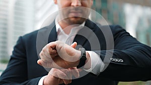 Close up of business man hand checking time for appointment or meeting. Urbane.