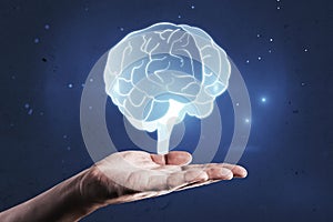 Close up of business man hand holding glowing human brain hologram on blurry wall background. Neurology research and artificial