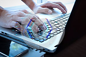 Close up of business man hand working on laptop computer on woo