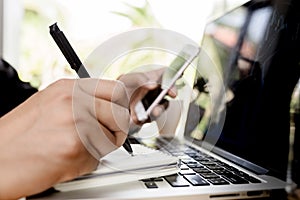 Close up business man hand working on laptop computer on wooden desk as concept, Man hand on laptop keyboard with blank screen