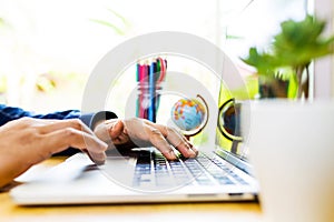 Close up business man hand working on laptop computer on wooden desk as concept, Man hand on laptop keyboard with blank screen