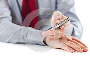 Close up of a business man using a mobile phone