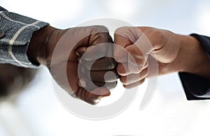 Close up.business partners give each other a fist