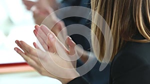 Close up of business people clapping hands