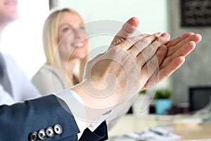 Close-up of business people clapping hands. Business seminar concept