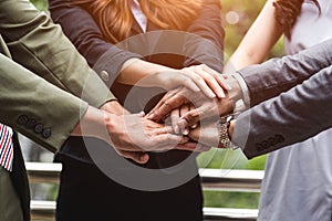 Close up of business people hands stacking as teamwork leadership assemble corporate in team company. Group of teamwork and