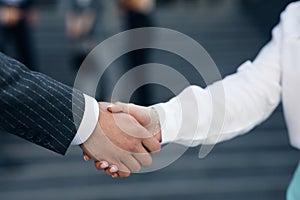 Close up Business People Shaking Hands Corporate Partnership Deal Welcoming Opportunity for Cooperation. Handshake of