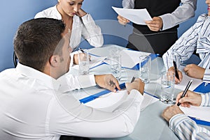 Close up of business people writing