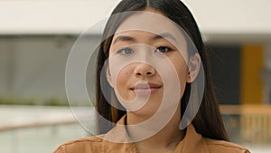 Close up business portrait Asian ethnic girl beautiful calm chinese korean japanese woman looking at camera female