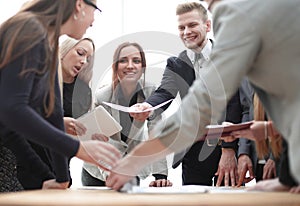 Close up. business team enthusiastically discuss working documents