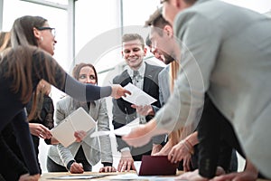 Close up. business team enthusiastically discuss working documents