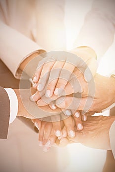 Close up of business team stacking hands
