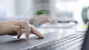 Close up of a business woman`s hand pressing on the touch pad