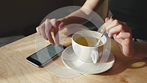 Close up of Business woman Sitting in Cafe Drinking Tea.