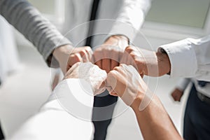 Close up .businessman and businesswoman making a fist bump on building background