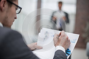 Close up.businessman checking financial data