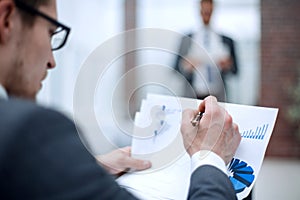 Close up.businessman checking financial data