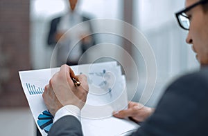 Close up.businessman checking financial data