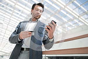 Close up.businessman dialing the number on the smartphone