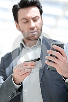 Close up.businessman dialing the number on the smartphone