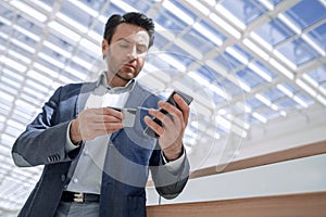 Close up.businessman dialing the number on the smartphone