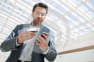 Close up.businessman dialing the number on the smartphone