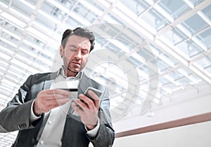 Close up.businessman dialing the number on the smartphone