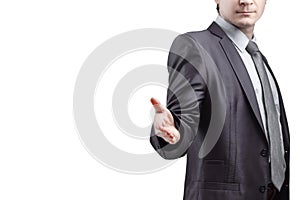 close up. the businessman extends his hand for greeting .isolated on grey background