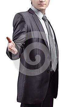 Close up. the businessman extends his hand for greeting .isolated on grey background