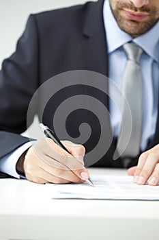 Close-up of businessman fill the form