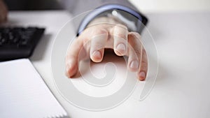 Close up of businessman hand banging fingers