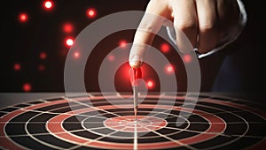 Close up of businessman hand hitting target with dart arrow. Success and achievement concept