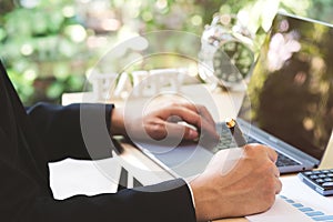 Close up businessman hand holding pen and taking note in paper a