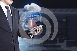 Close up of businessman hand holding smartphone in blurry office interior with abstract hologram raining cloud. Data, information