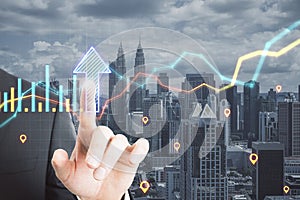 Close up of businessman hand pointing at abstract glowing growth chart and arrow on blurry city background with location marks.