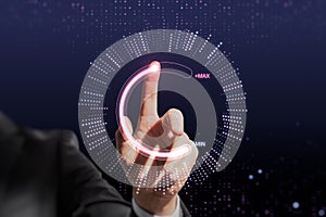 Close up of businessman hand pointing at abstract glowing max and min scale hologram on dark background. Volume control and future