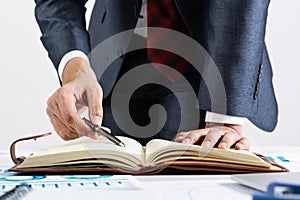 Close-up businessman hand writing to do list