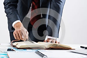 Close-up businessman hand writing to do list