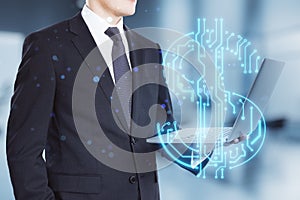 Close up of businessman hands holding laptop with abstract glowing blue circuit dollar hologram on blurry bokeh office interior