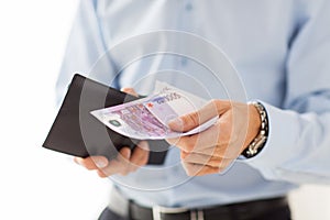 Close up of businessman hands holding money