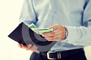 Close up of businessman hands holding money