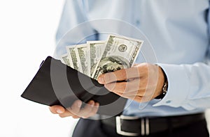 Close up of businessman hands holding money