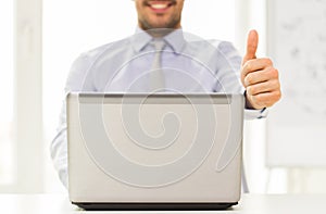 Close up of businessman hands with laptop