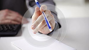 Close up of businessman hands with notepad