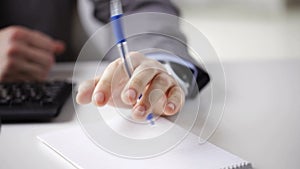 Close up of businessman hands with notepad