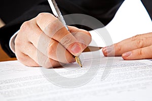 Close up on a businessman hands signing a contract