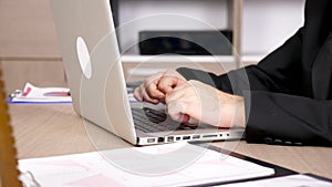 Close up businessman hands typing on laptop keyboard