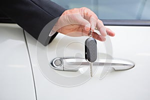 Close up of businessman holding car key