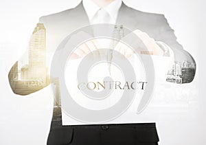 Close up of businessman holding contract paper